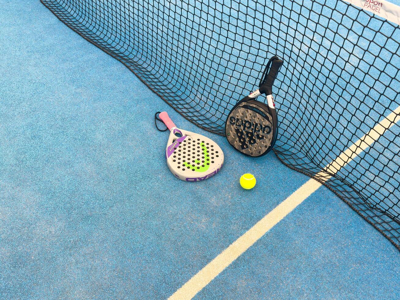 Kyiv, Ukraine, July 10, 2024 paddle tennis racket and balls, adidas, head photo