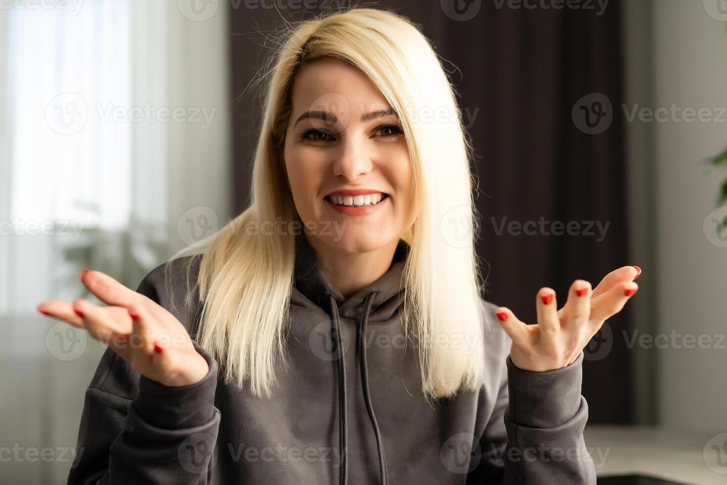 Portrait of a smiling young lady looking at camera, head shot photo