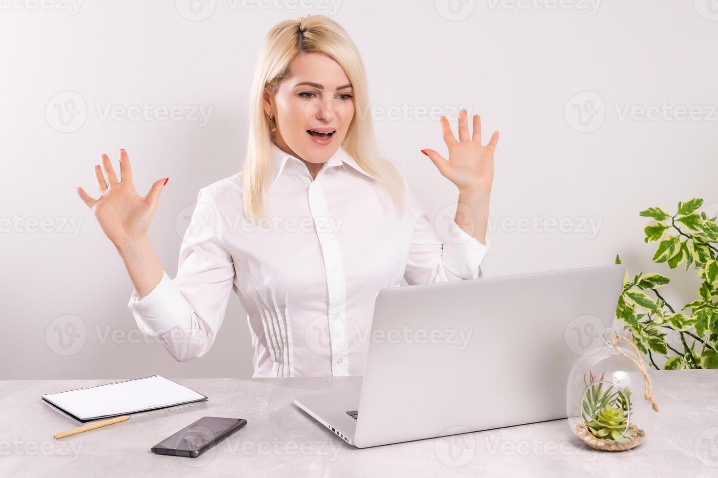 Euphoric and surprised winner winning online watching a laptop at home photo