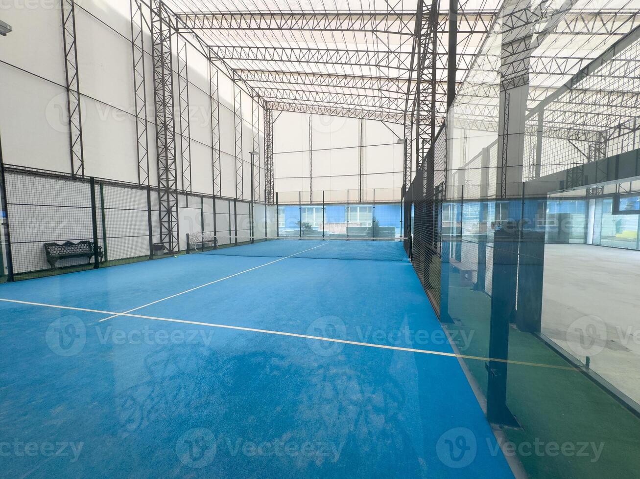 Padel court with lines and net indoor photo