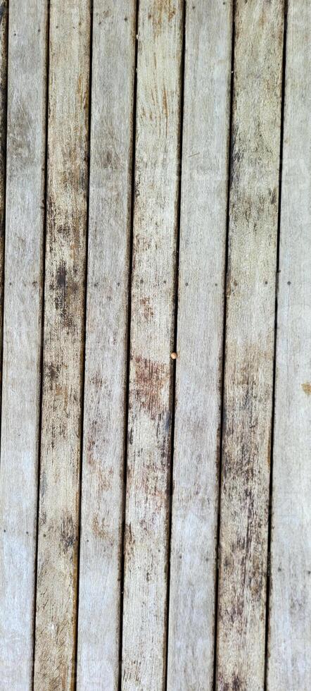 old slatted wood background with shadows photo