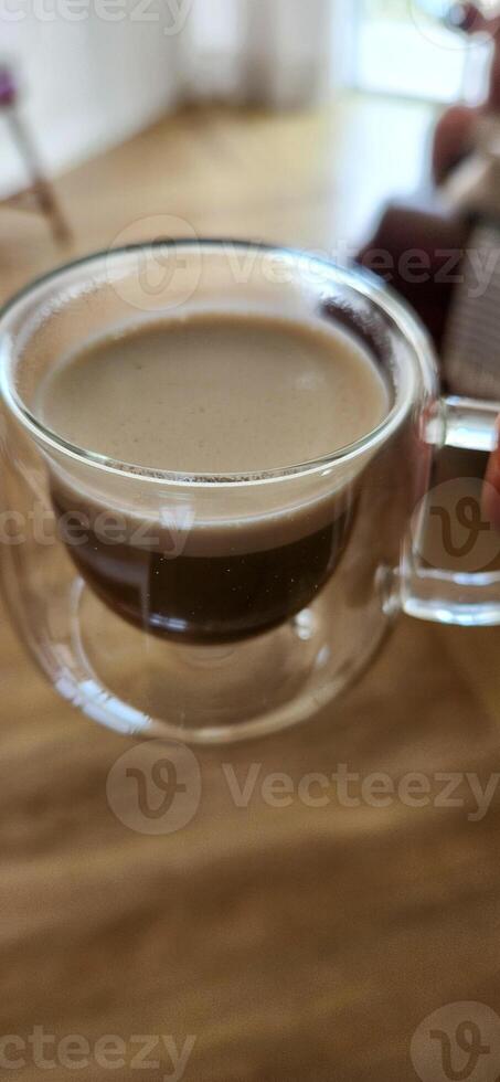 Enjoy the moment with the elegance of this coffee cup in a woman's hands. Warmth and flavor in every detail. Get this irresistible image now photo