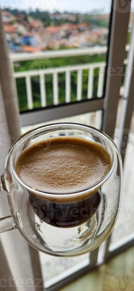 Enjoy the moment with the elegance of this coffee cup in a woman's hands. Warmth and flavor in every detail. Get this irresistible image now photo