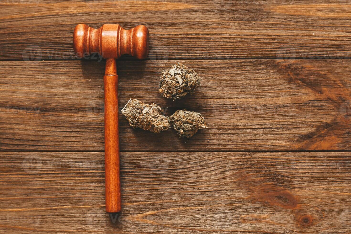 Medical marijuana, inflorescences of shinki herb plant with judge's gavel, law concept photo