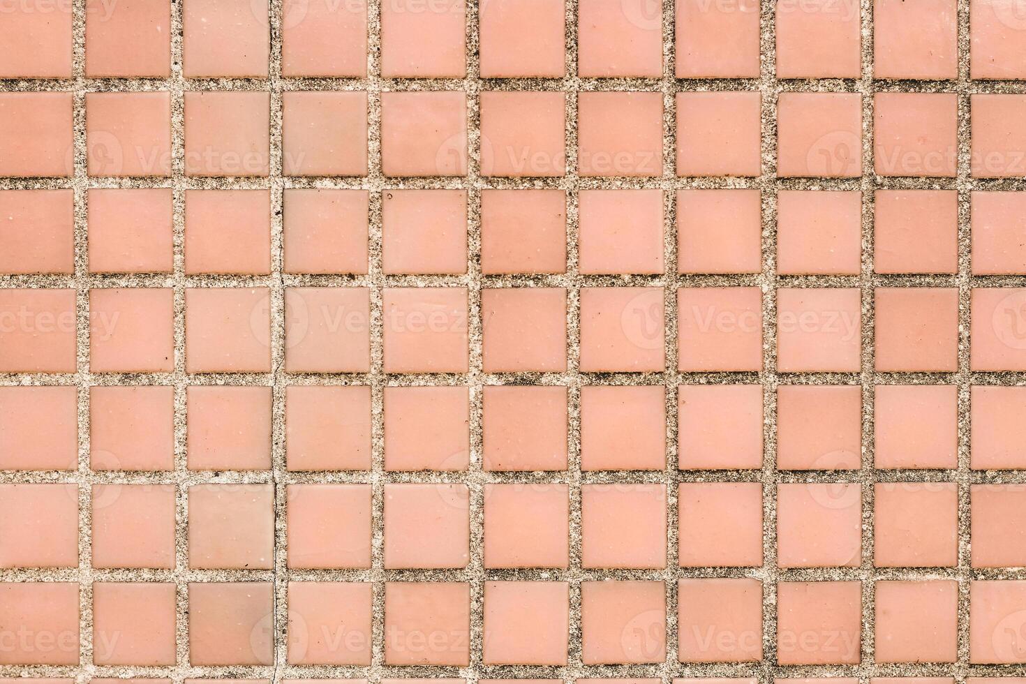 Texture of pink mosaic tiles, close-up photo