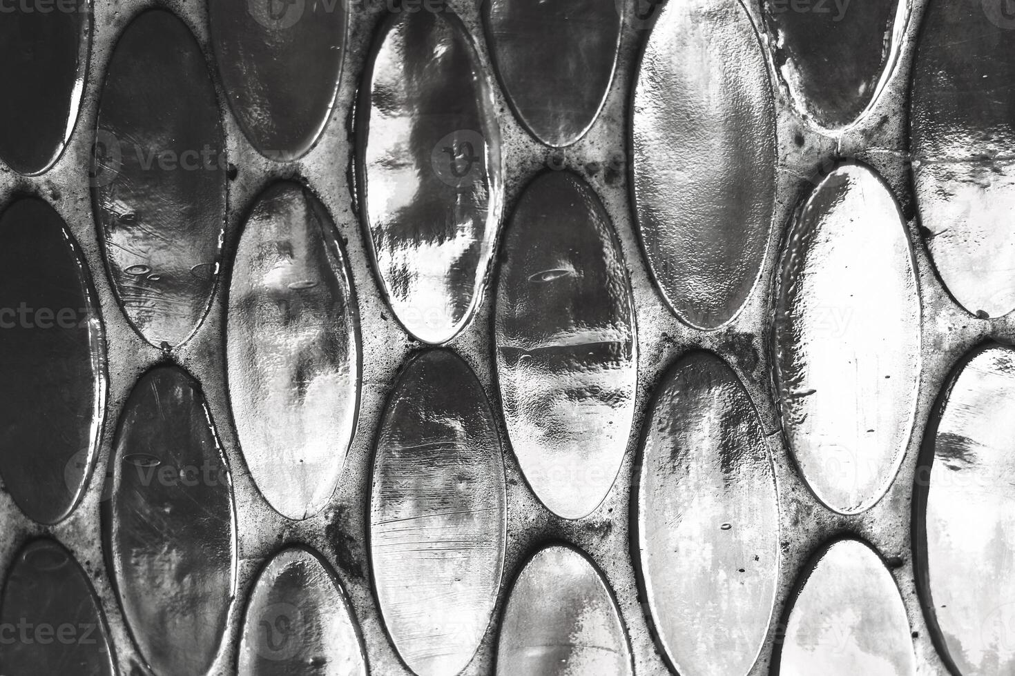 Texture of mother-of-pearl mosaic round tiles, close-up photo