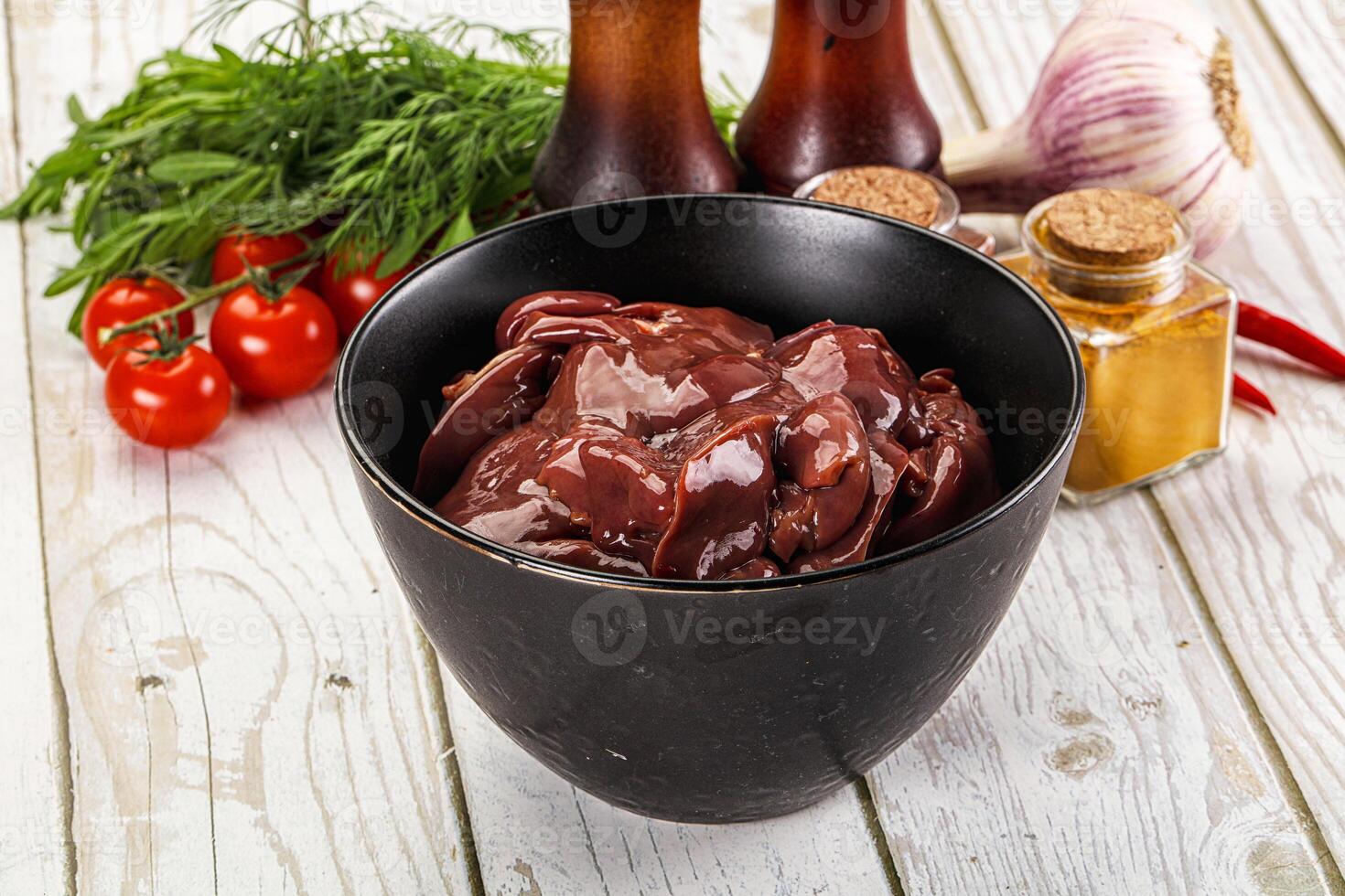Raw chicken liver uncooked in the bowl photo