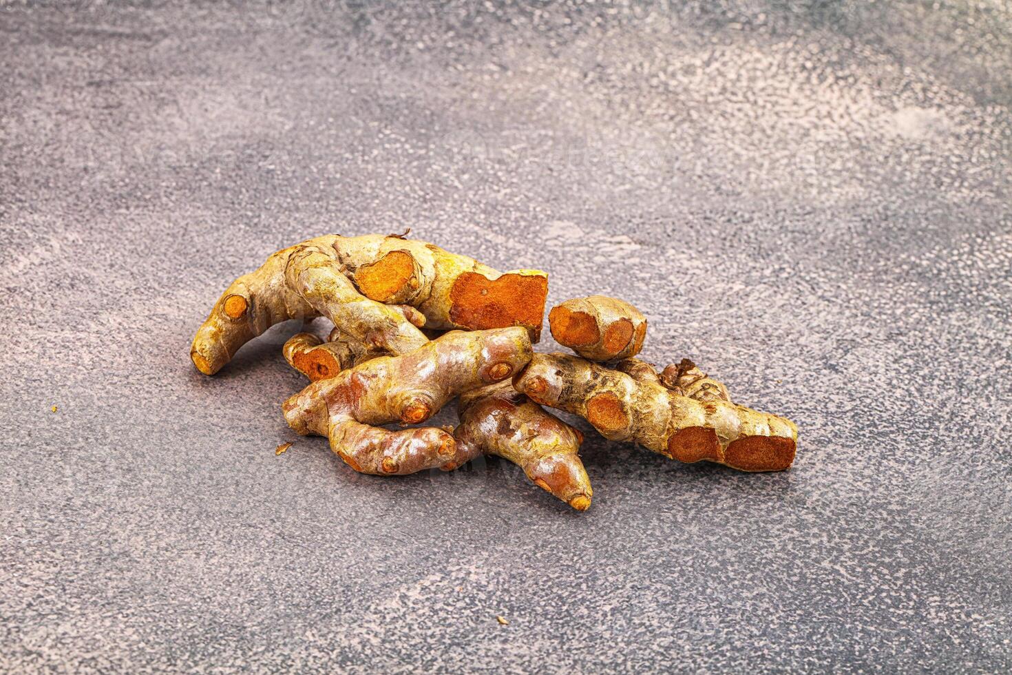 Fresh young Tumeric root heap photo