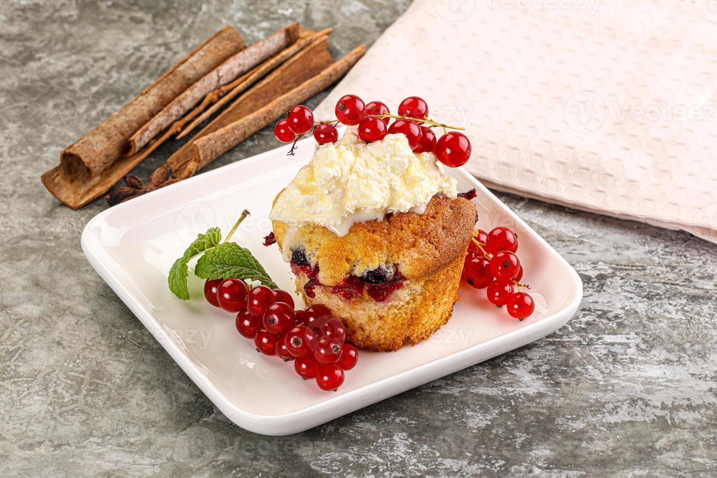 Delicous cupcake with red currant photo