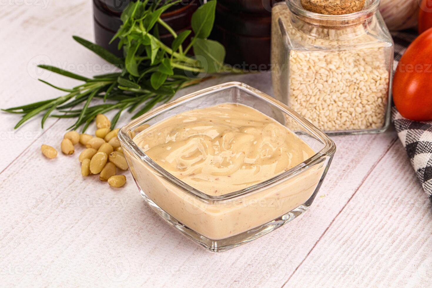 Delicious walnut creamy sauce in the bowl photo