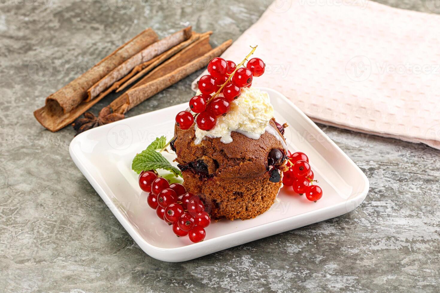 Delicous cupcake with red currant photo