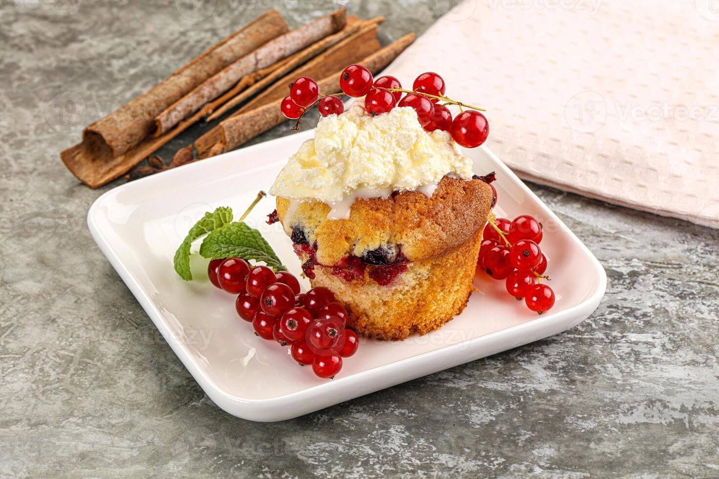 Delicous cupcake with red currant photo