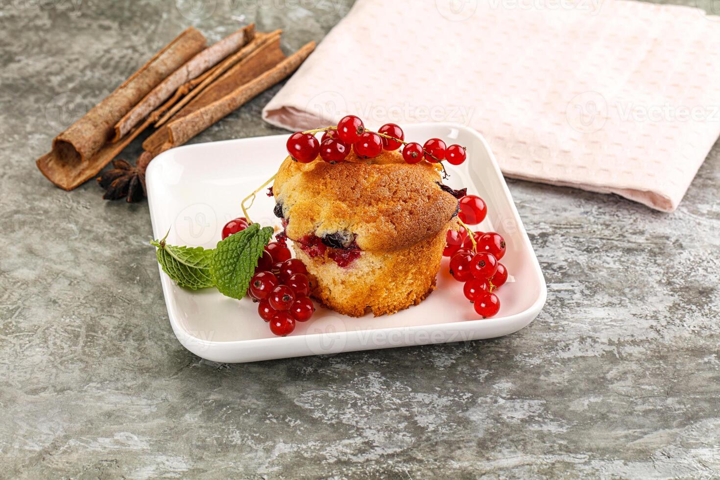 Delicous cupcake with red currant photo
