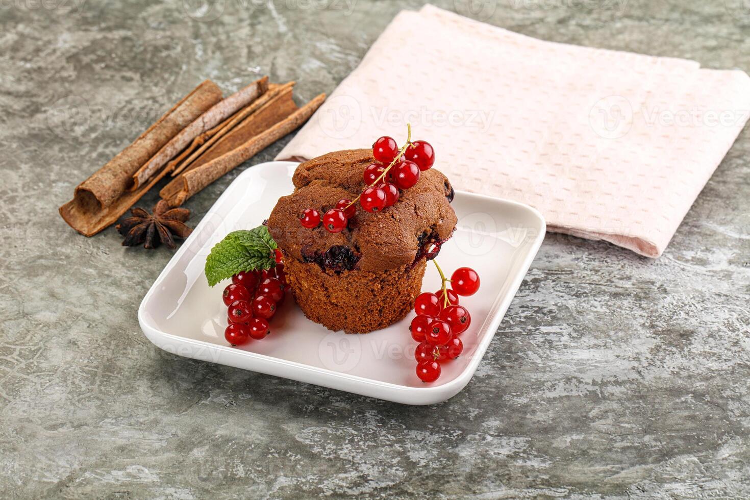 Delicous cupcake with red currant photo