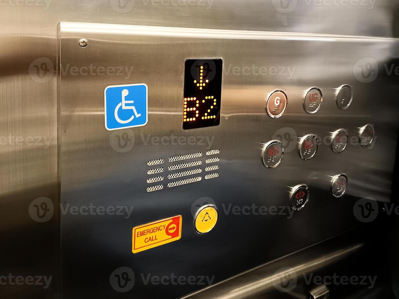Modern Elevator Control Panel with Disabled Access and Emergency Call Button in Stainless Steel Interior photo
