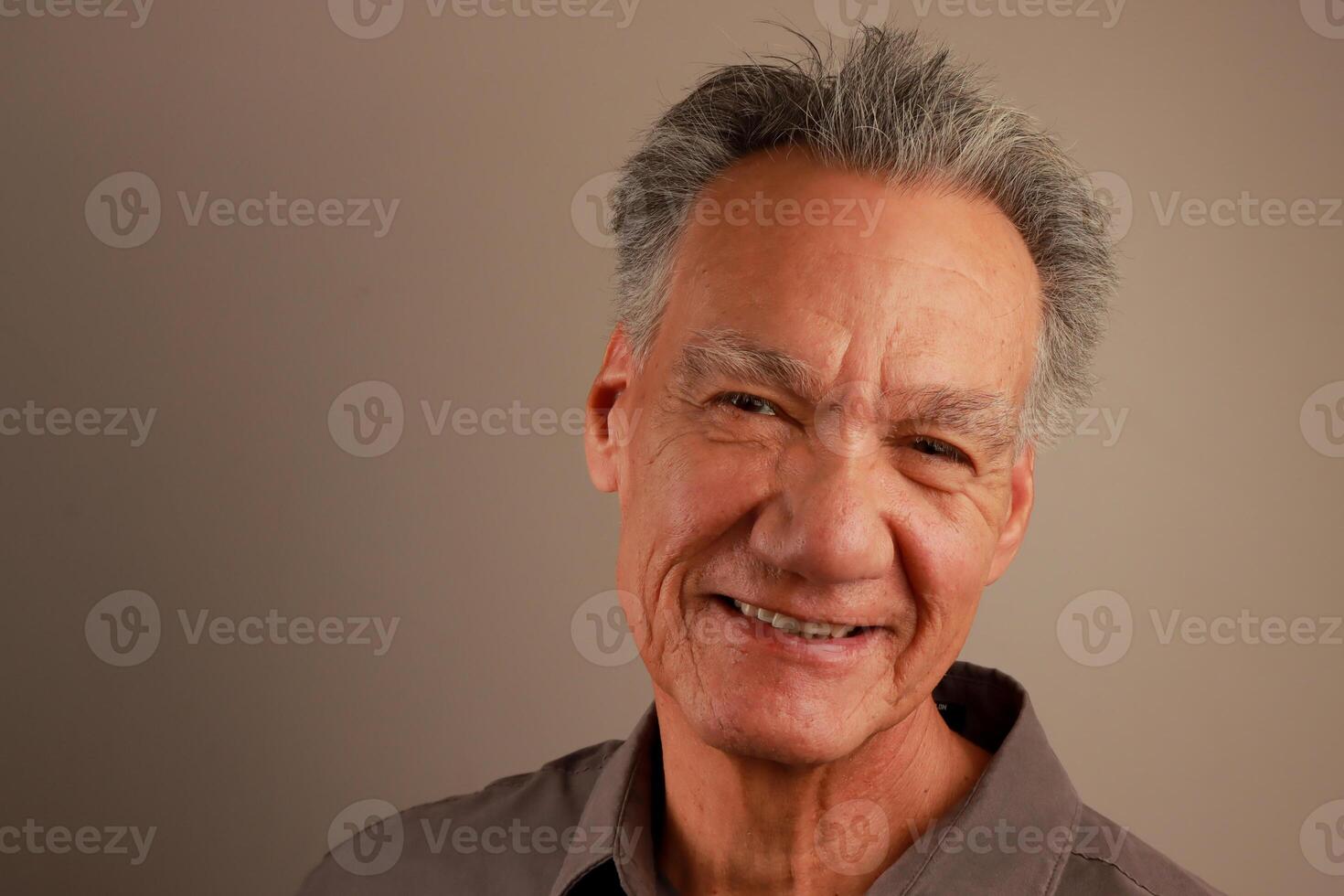 Close up Portrait of a Happy Mature Man Smiling photo