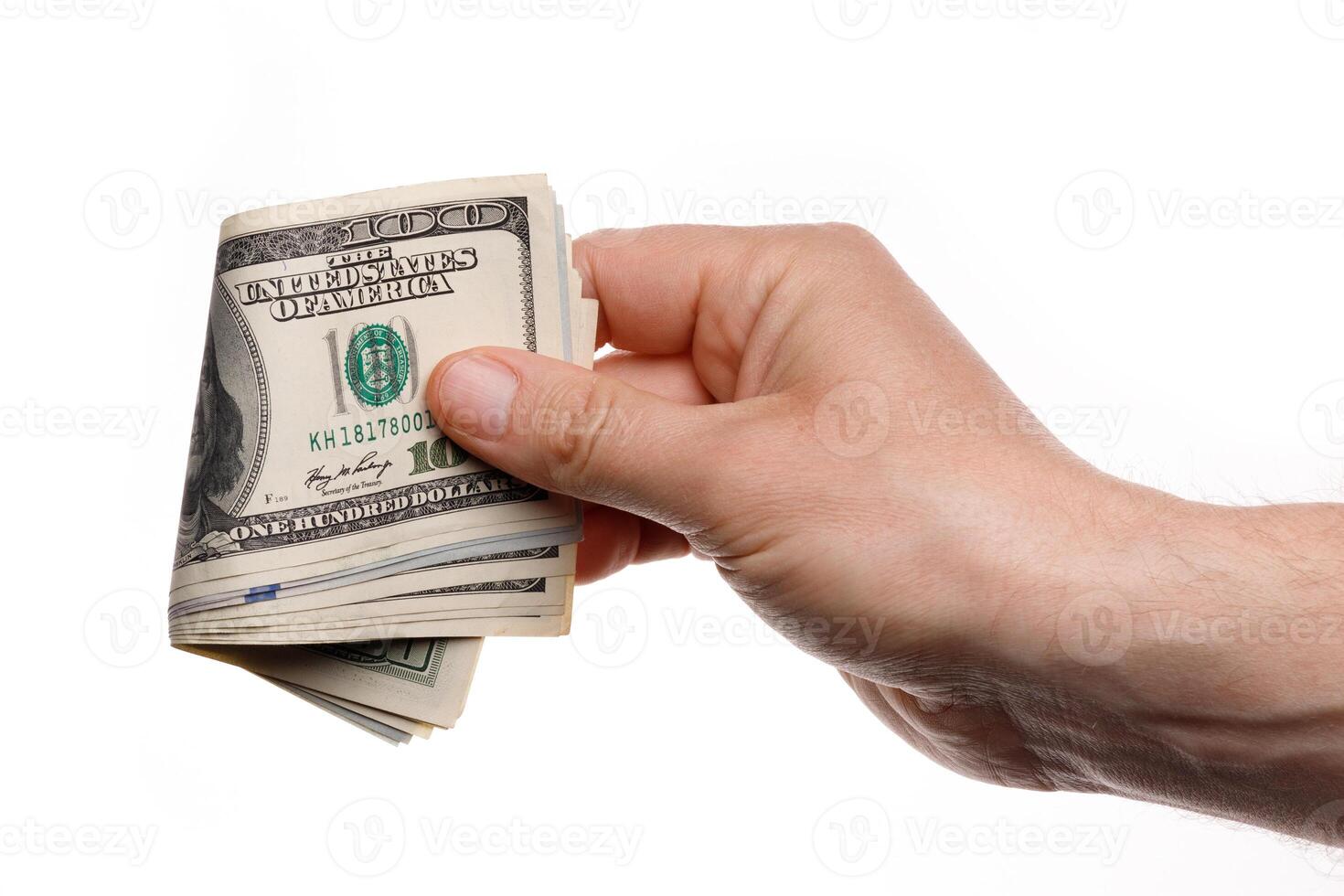 Hand holding money with One hundred dollars banknotes isolated on a white background photo