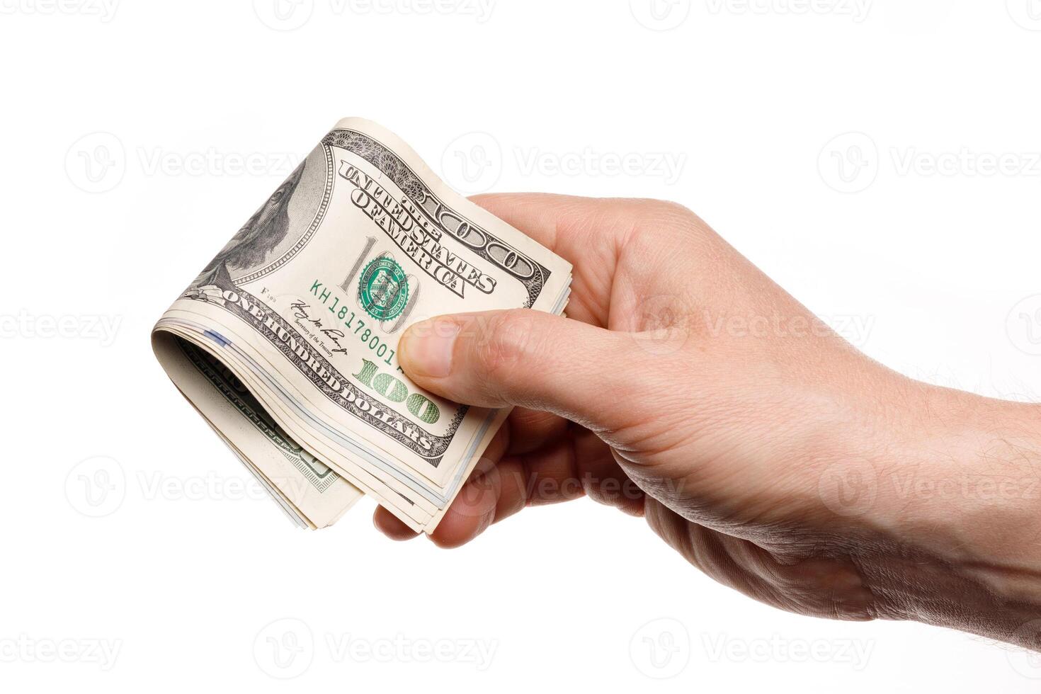 Hand holding money with One hundred dollars banknotes isolated on a white background photo