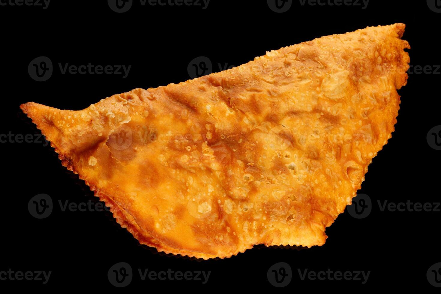 Chebureks delicious meat pie on a black background photo