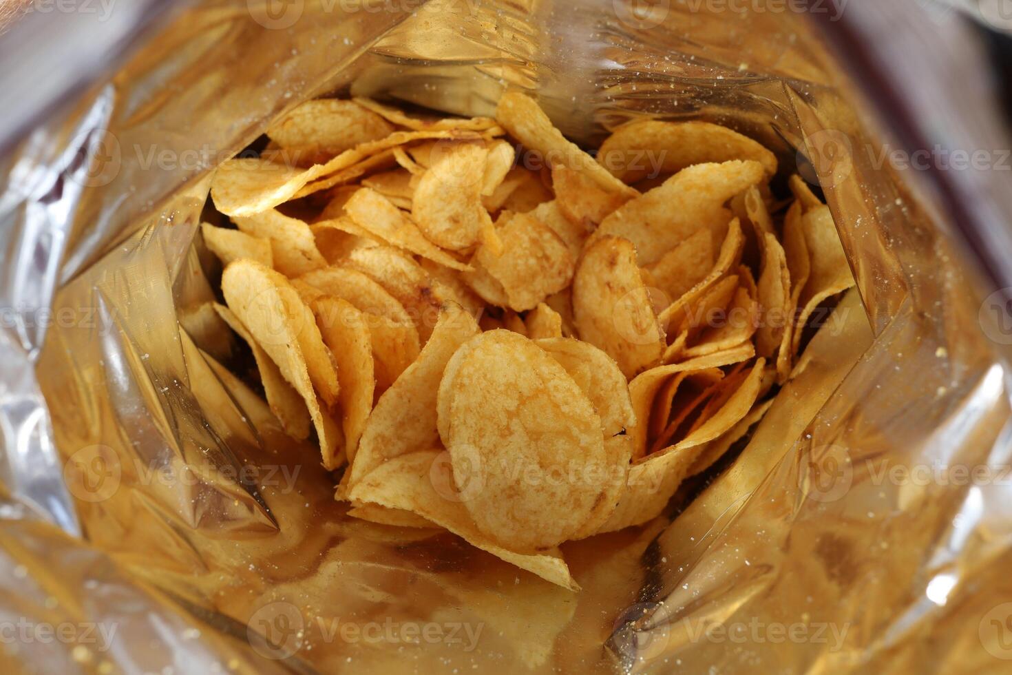 Potato chips in a package inside. Snacks in a package close-up. photo