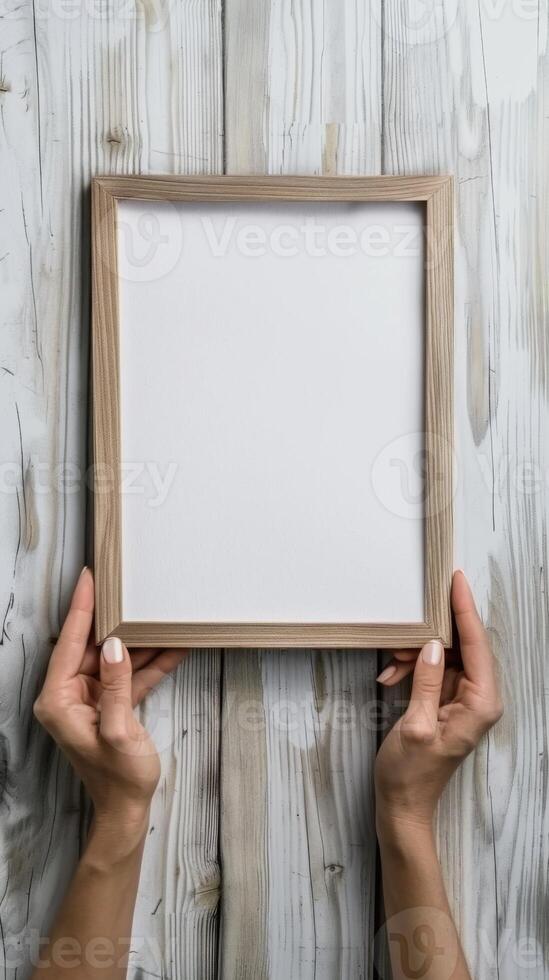 Hands Placing Blank Photo Frames on Wall for Mockup