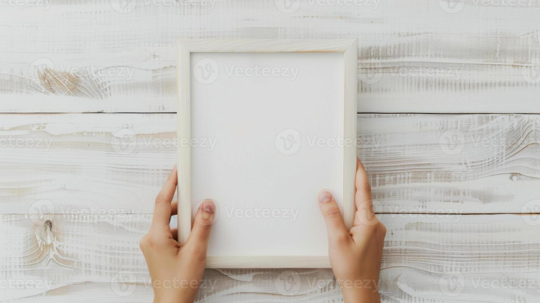 Hands Placing Blank Photo Frames on Wall for Mockup