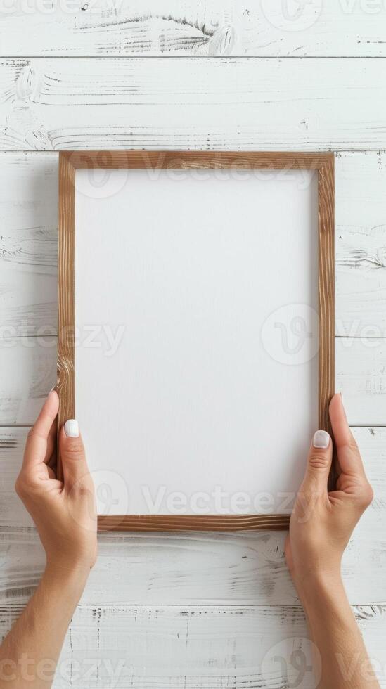 Hands Placing Blank Photo Frames on Wall for Mockup