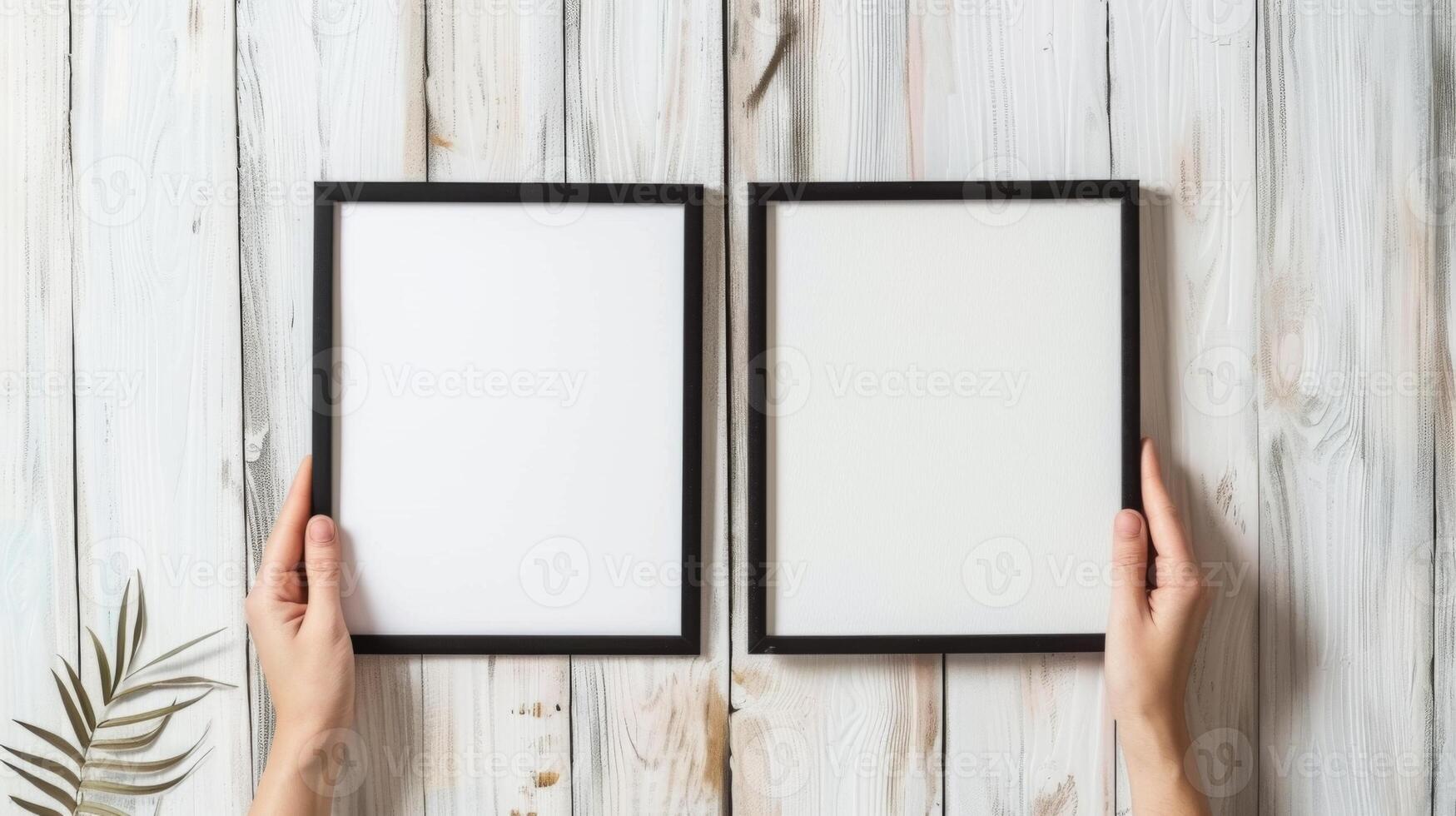Hands Placing Blank Photo Frames on Wall for Mockup