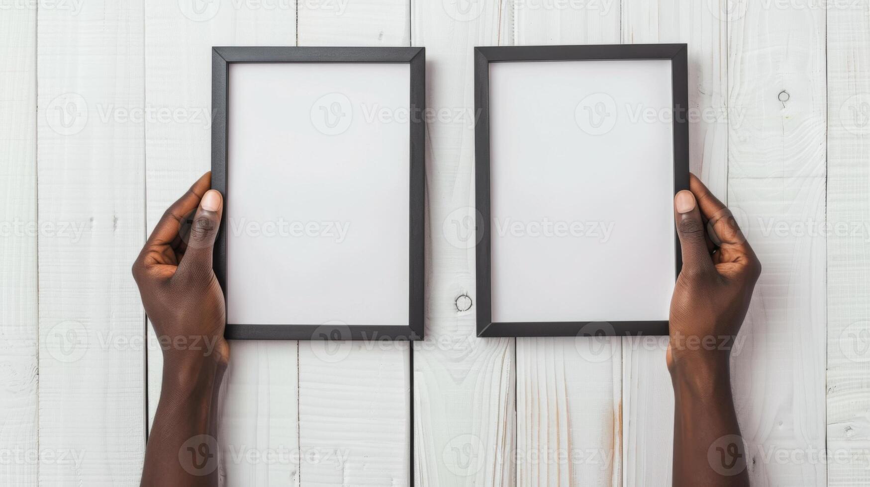 Hands Placing Blank Photo Frames on Wall for Mockup