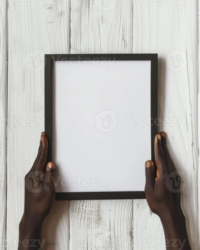 Hands Placing Blank Photo Frames on Wall for Mockup