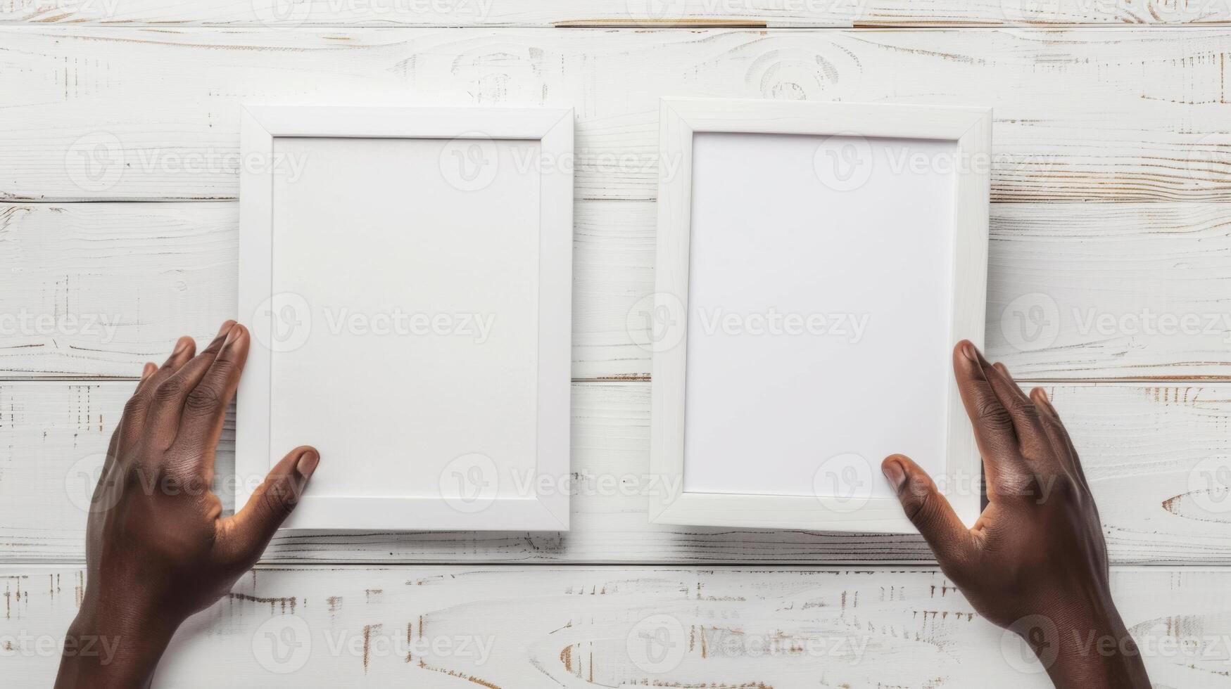 Hands Placing Blank Photo Frames on Wall for Mockup
