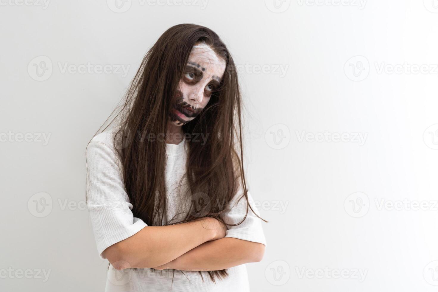 scary girl in white dress from horror film photo