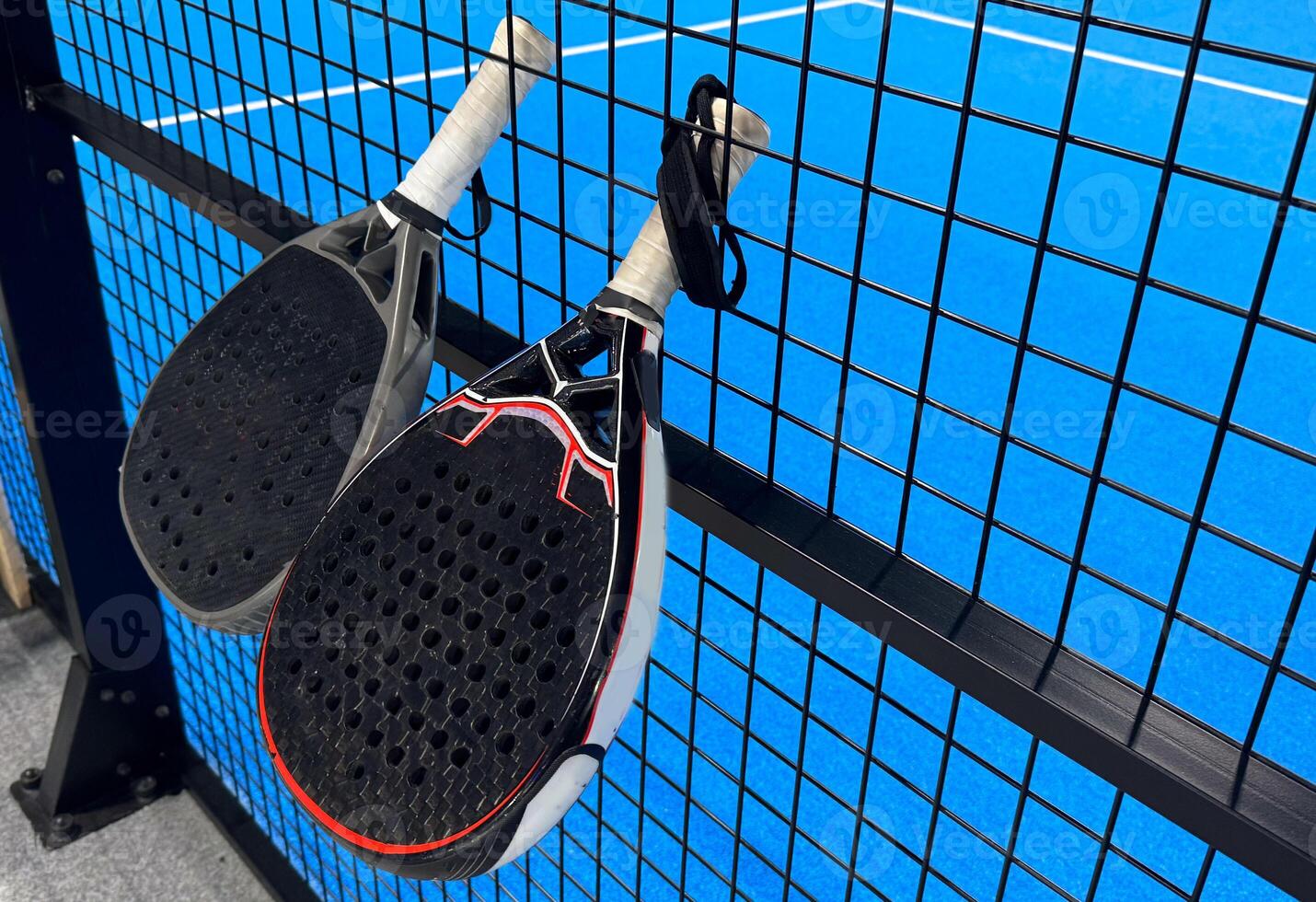 Padel tennis racket. Background with copy space. Sport court and balls. photo