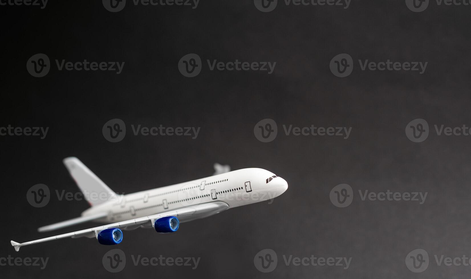 Model plane, airplane on dark background. photo