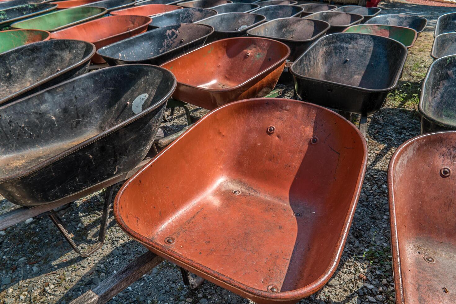 Wheelbarrows parked together photo