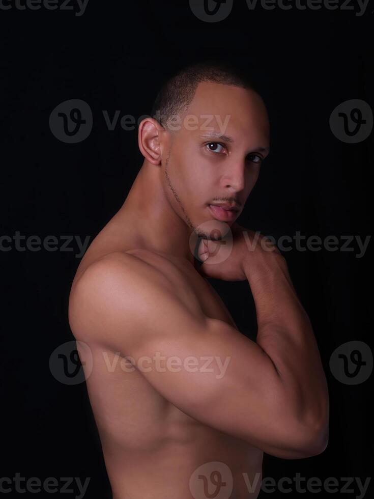 Handsome African American Man Without Shirt Showing Muscles photo