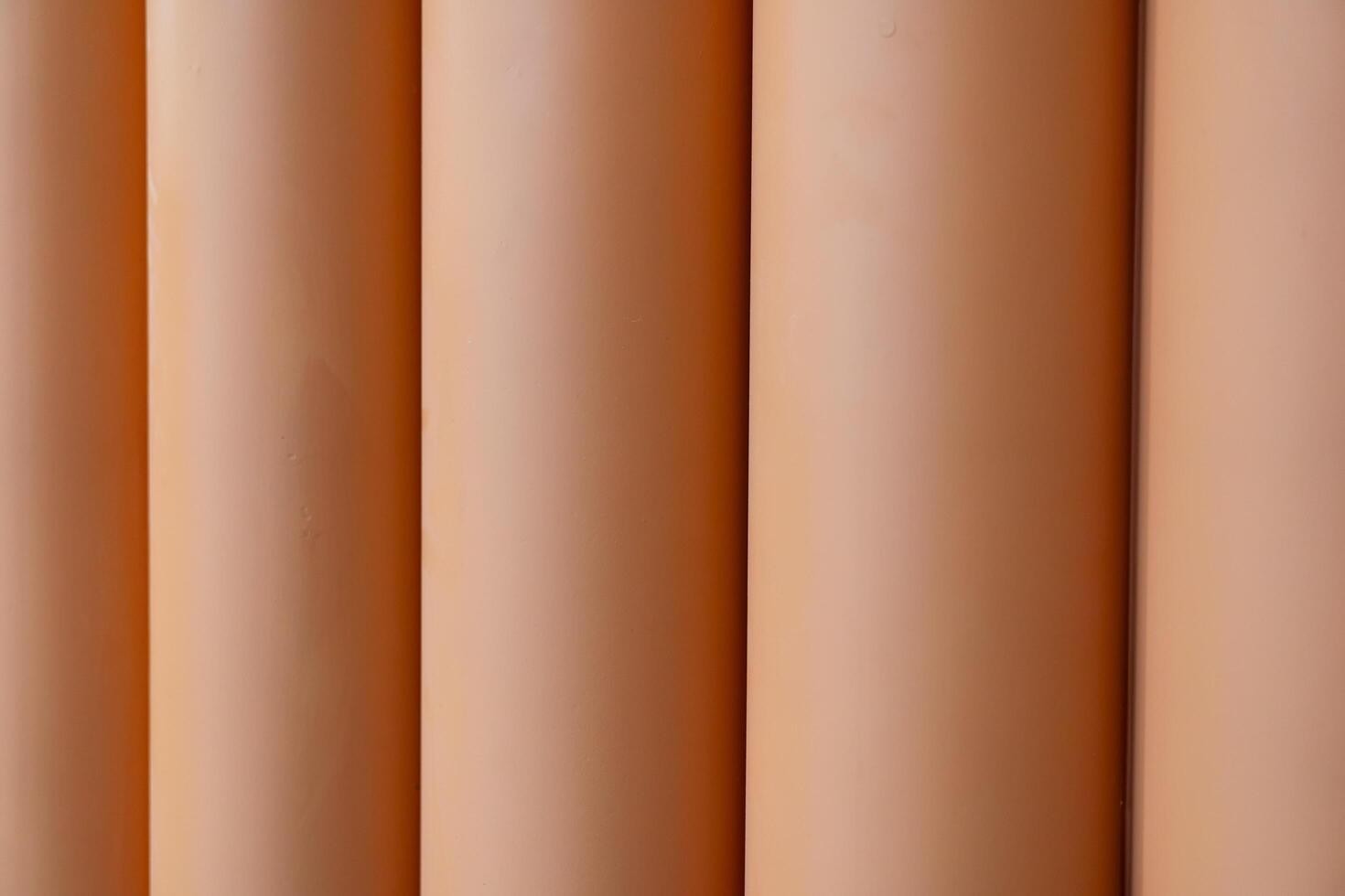 Vertical lines with a warm color palette. The colors transition smoothly from a light beige at the top to a deep. Background concept. photo