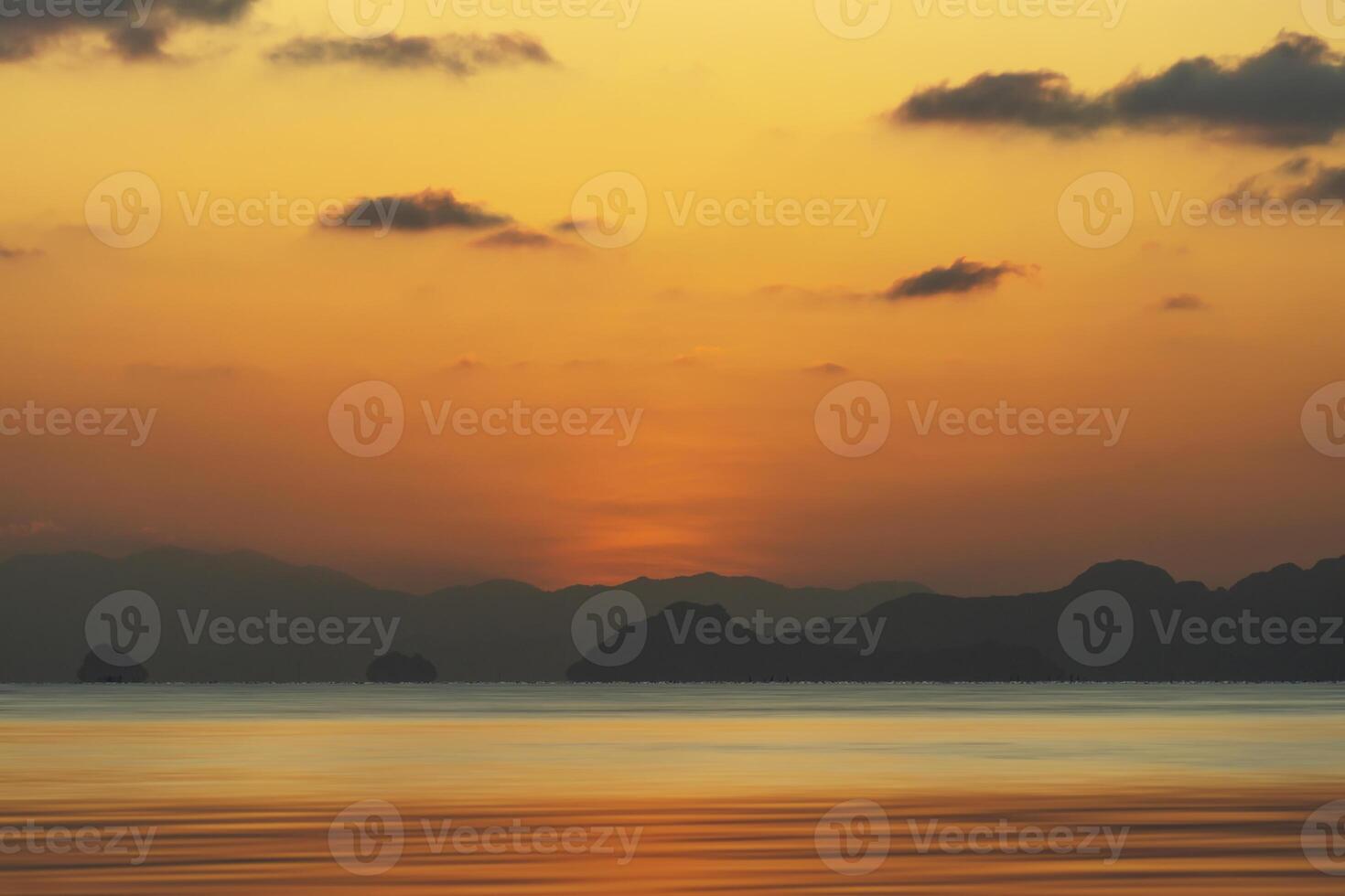 Sunset sky at the lake with dark clouds. photo