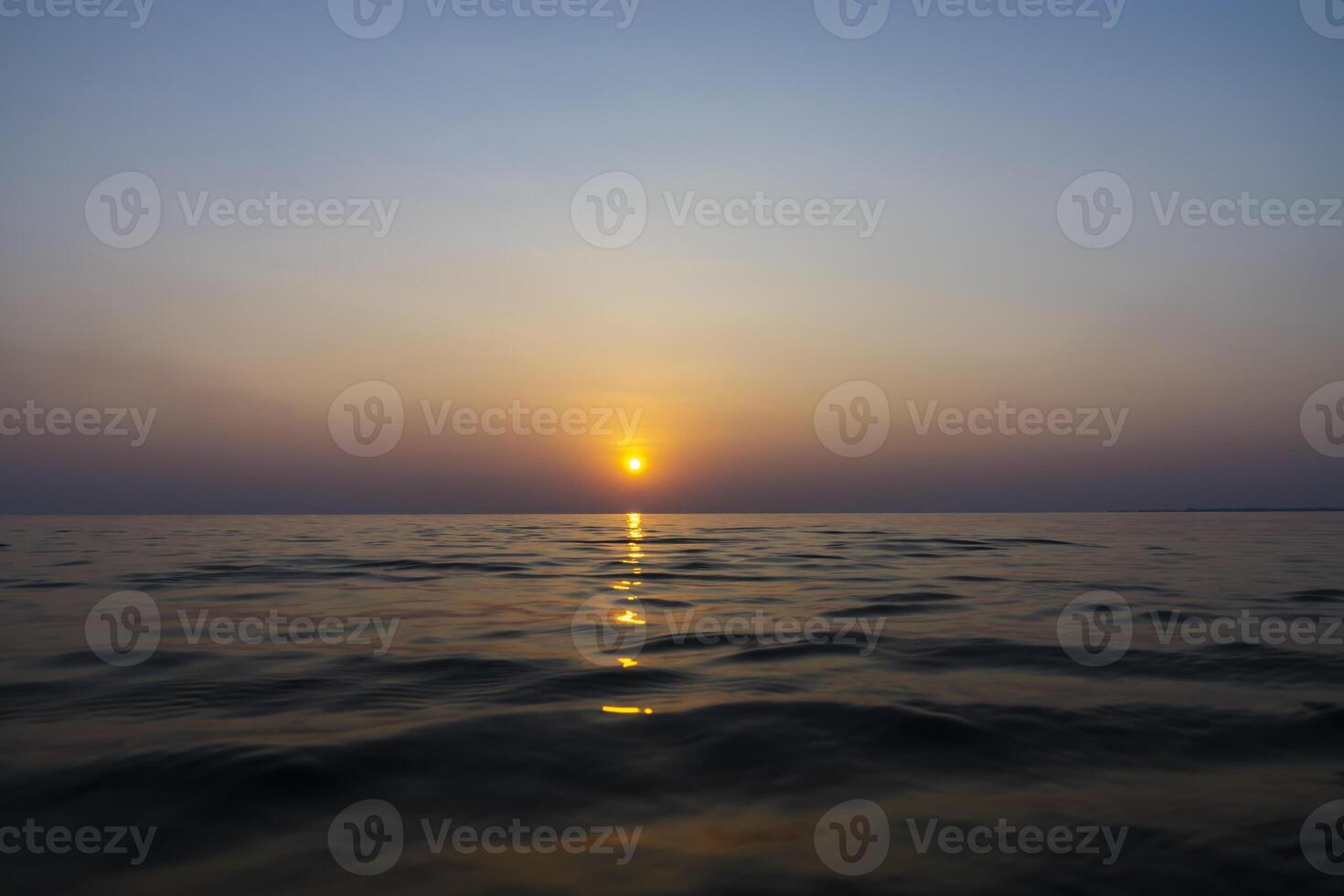 Sunset sky reflection on the water at the lake. photo