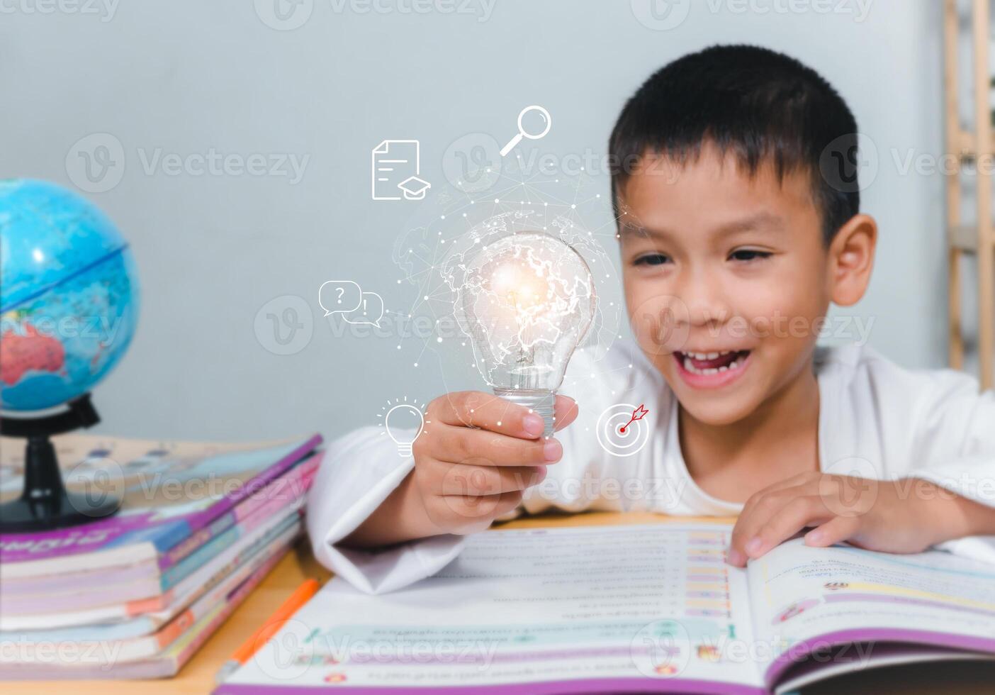 Education concept, Smart kid against green blackboard, Boy holding a bright light bulb to represent new creativity, Idea and creativity concept, Copy space for your text. photo