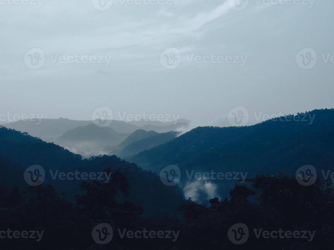 View on the mountain in the evening, close to night, slightly foggy. photo