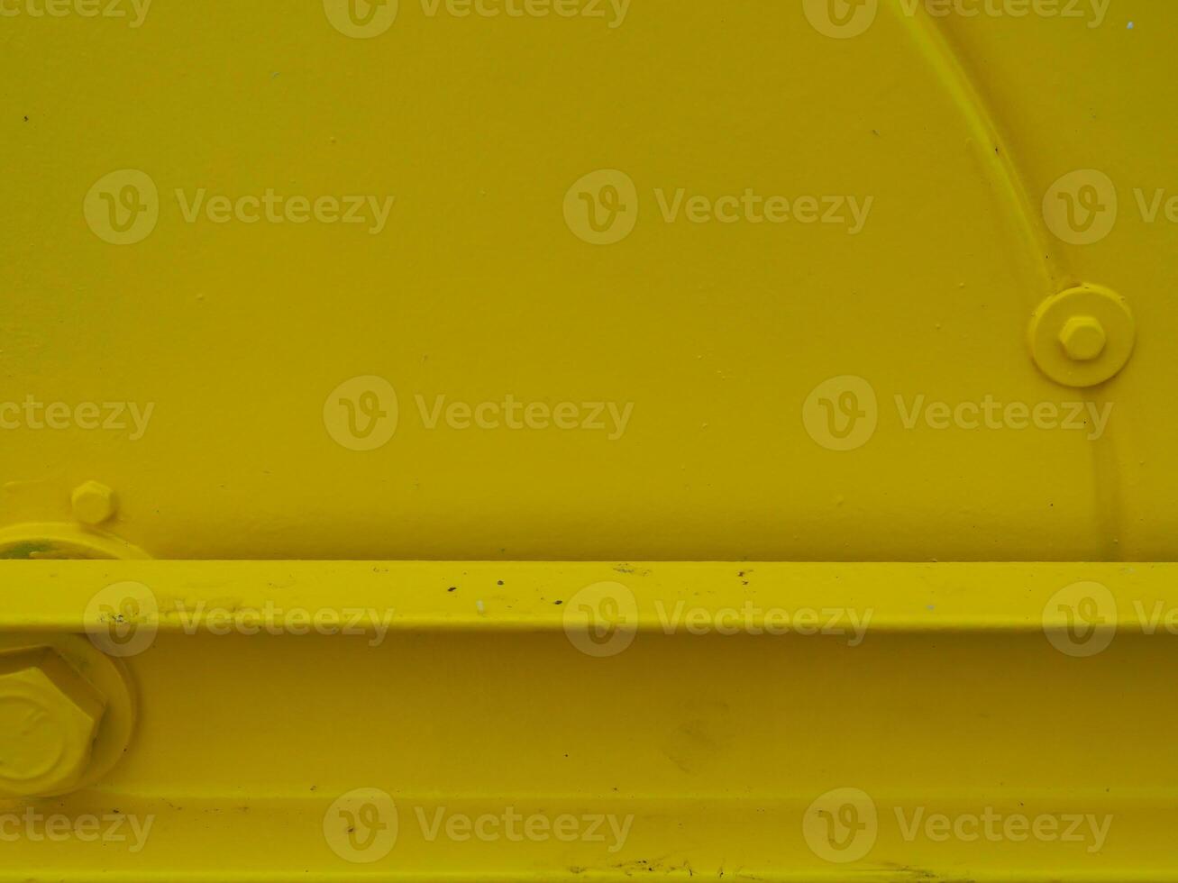 Yellow painted steel texture for a close-up background of a building or construction. photo
