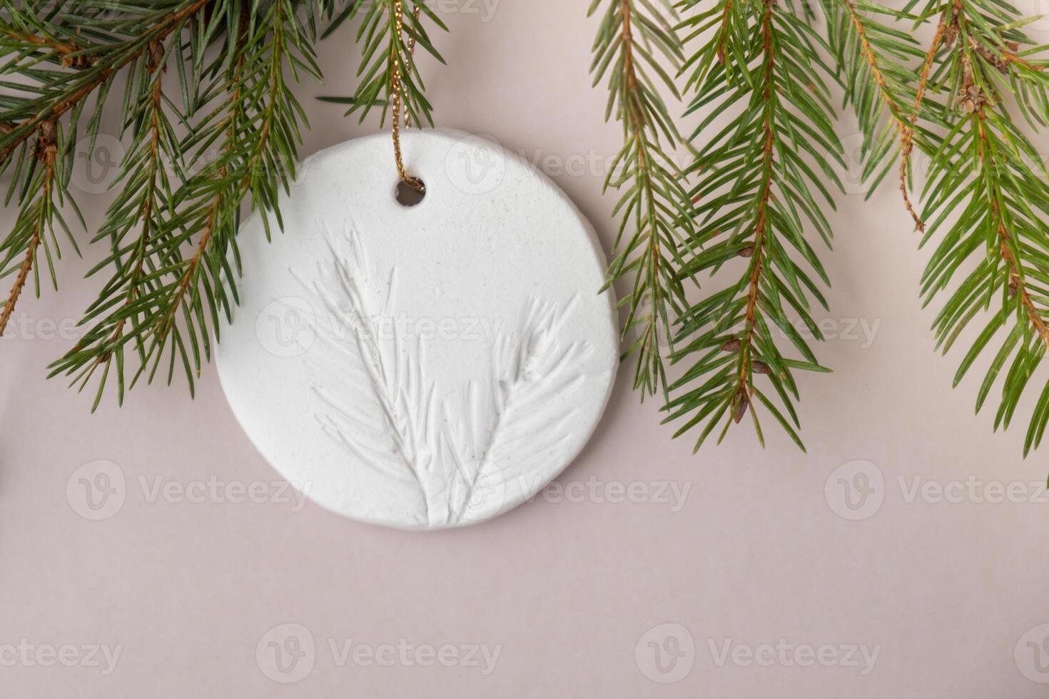 White air dry clay for making decor to Christmas tree holiday. Creating hobby recreation activity that involves fingers. DIY crafting Modern art photo