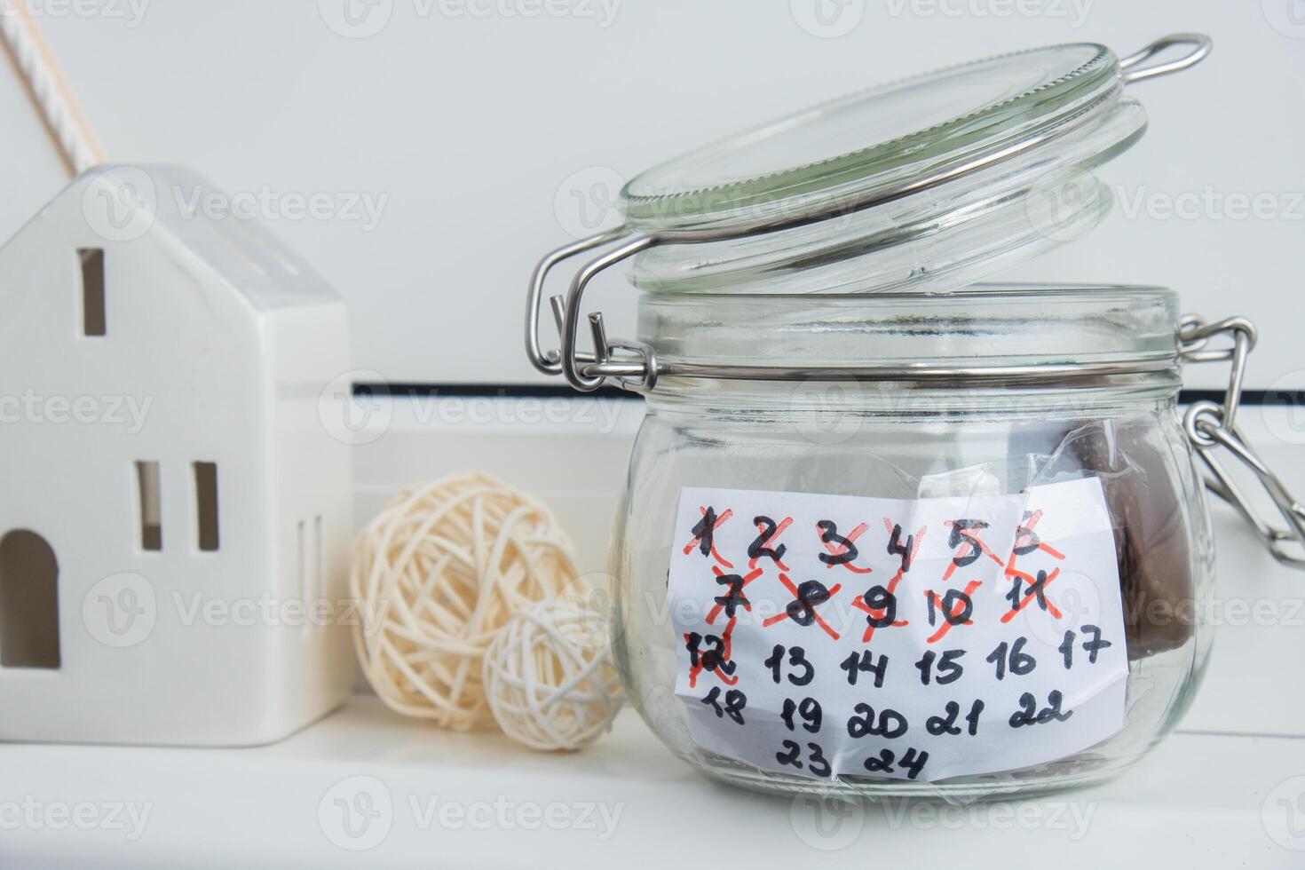 Original Advent Calendar made of glass jar and sweet chocolate candies Christmas concept. Countdown till winter holidays. Handmade advent calendar. Step by step DIY crafts do it yourself photo