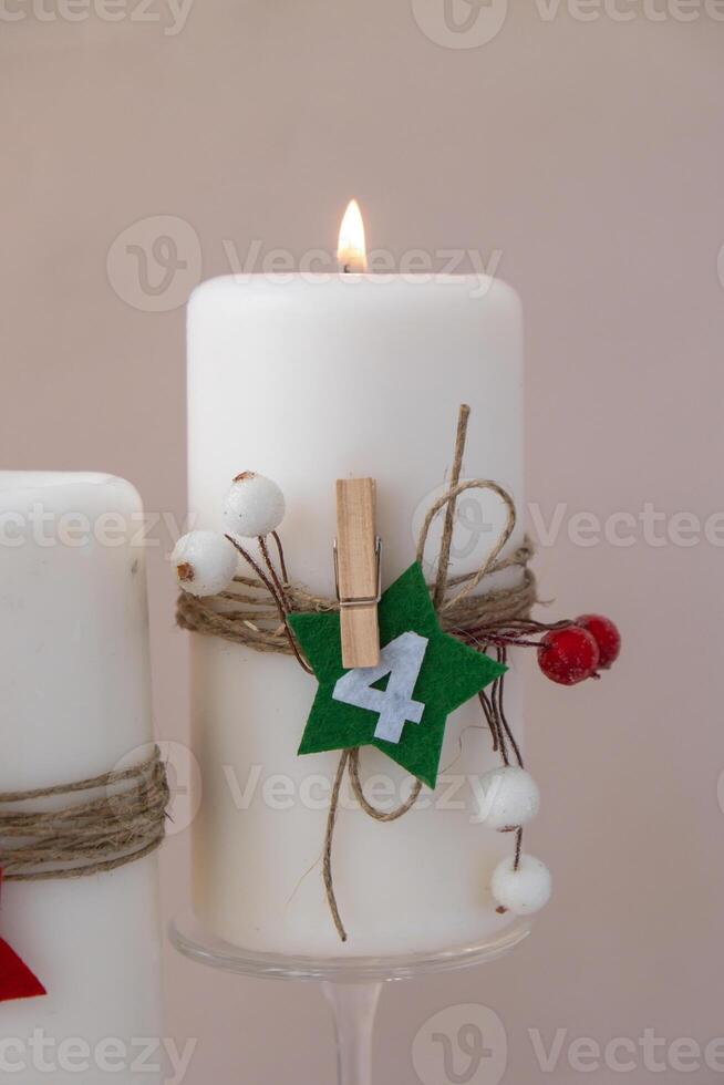 New year and Christmas preparation. Four-week advent candles on table. Handmade eco-friendly decor. Sustainable Christmas decoration. Copy space photo