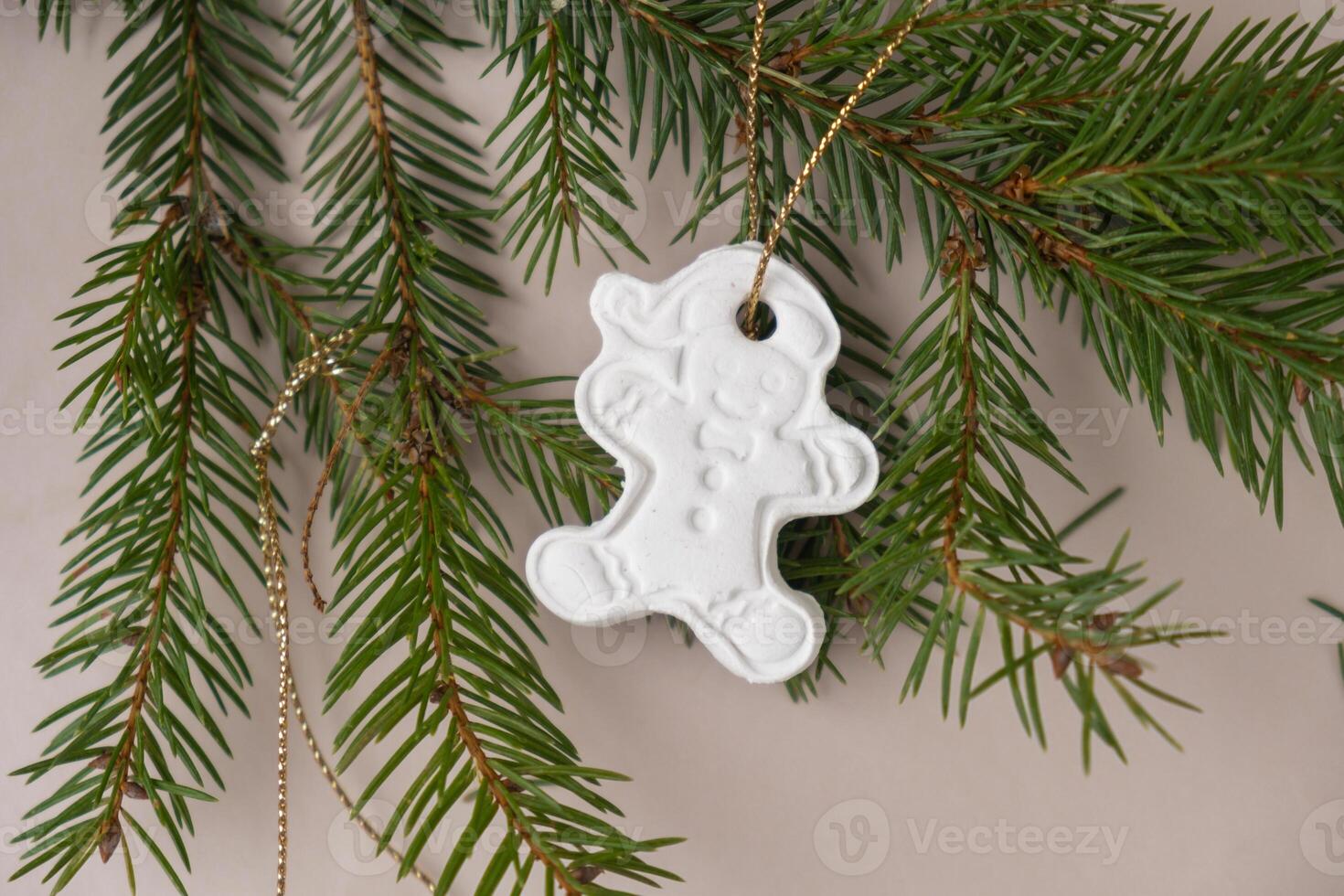 Gingerbread character White air dry clay for making decor to Christmas tree holiday. Creating hobby recreation activity that involves fingers. DIY crafting Modern art photo