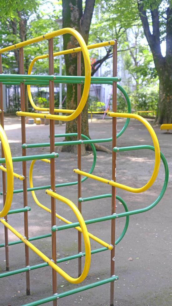 Yellow joyful climbing frame for child and kids in Japan playground photo