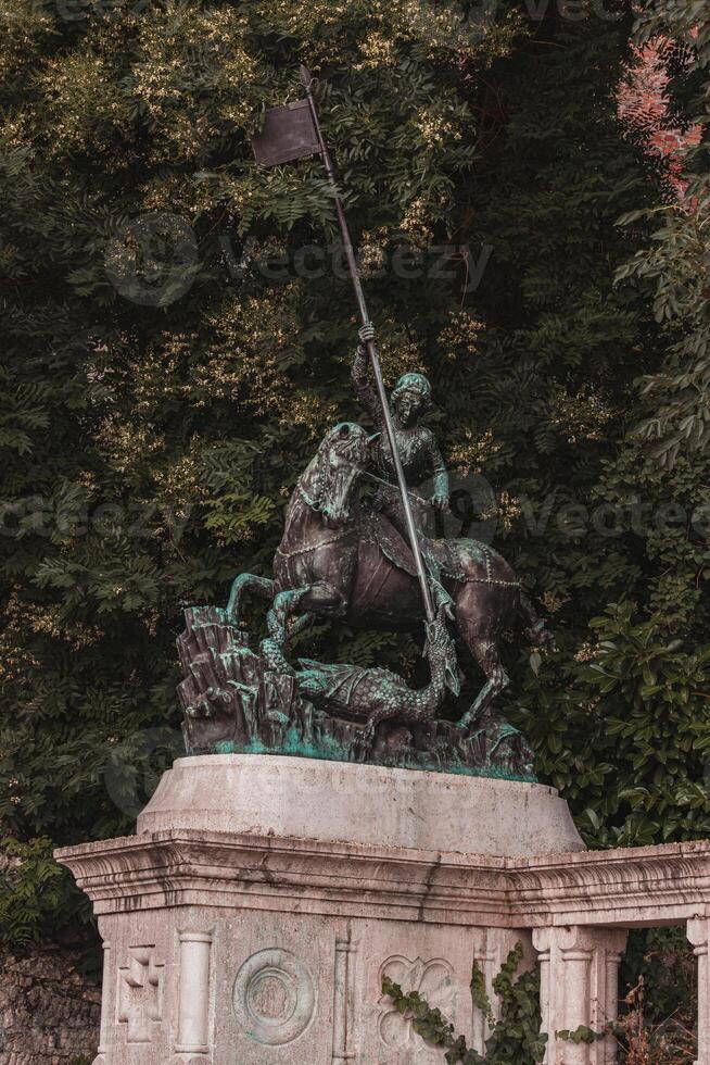 Bronze statue of a man on a horse with a spear Hungary Budapest 23.06.24 photo