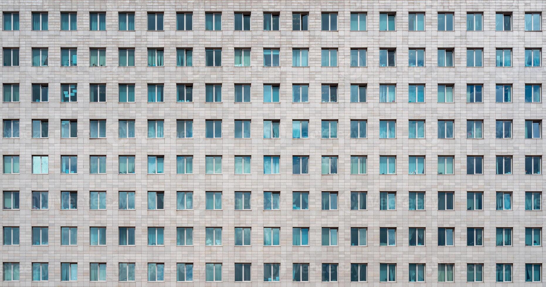 Modern office building. Windows of a multi-storey skyscraper. Rows of identical windows. photo