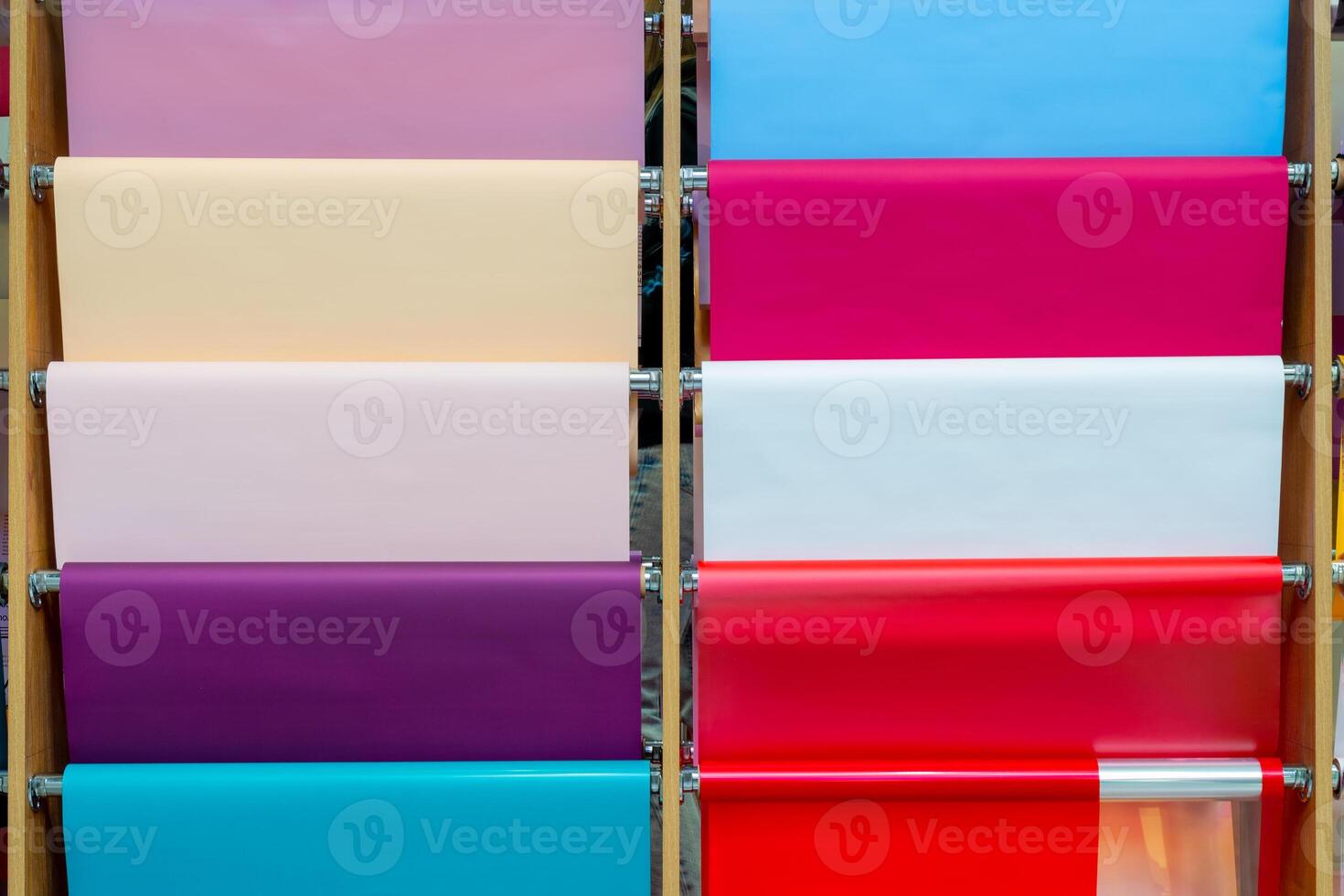 Multicolored rolls of wrapping paper on the showcase. Abstract background. photo